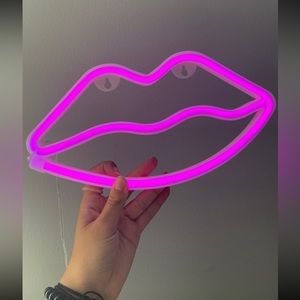 Neon pink lips sign